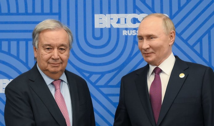 President of Russia Vladimir Putin, right, and UN Secretary-General Antonio Guterres