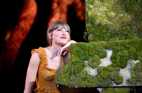 Taylor Swift holding a contract symbolizing ownership of her master recordings as record labels panic