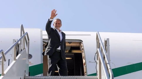 Iranian President Masoud Pezeshkian disembarks from aircraft during official visit
