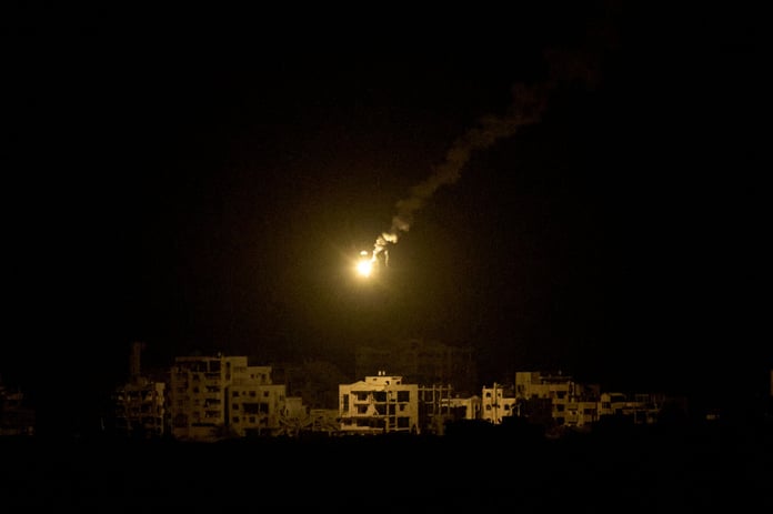 Gaza City skyline at night as explosions light the sky during renewed bombardment, September 2025
