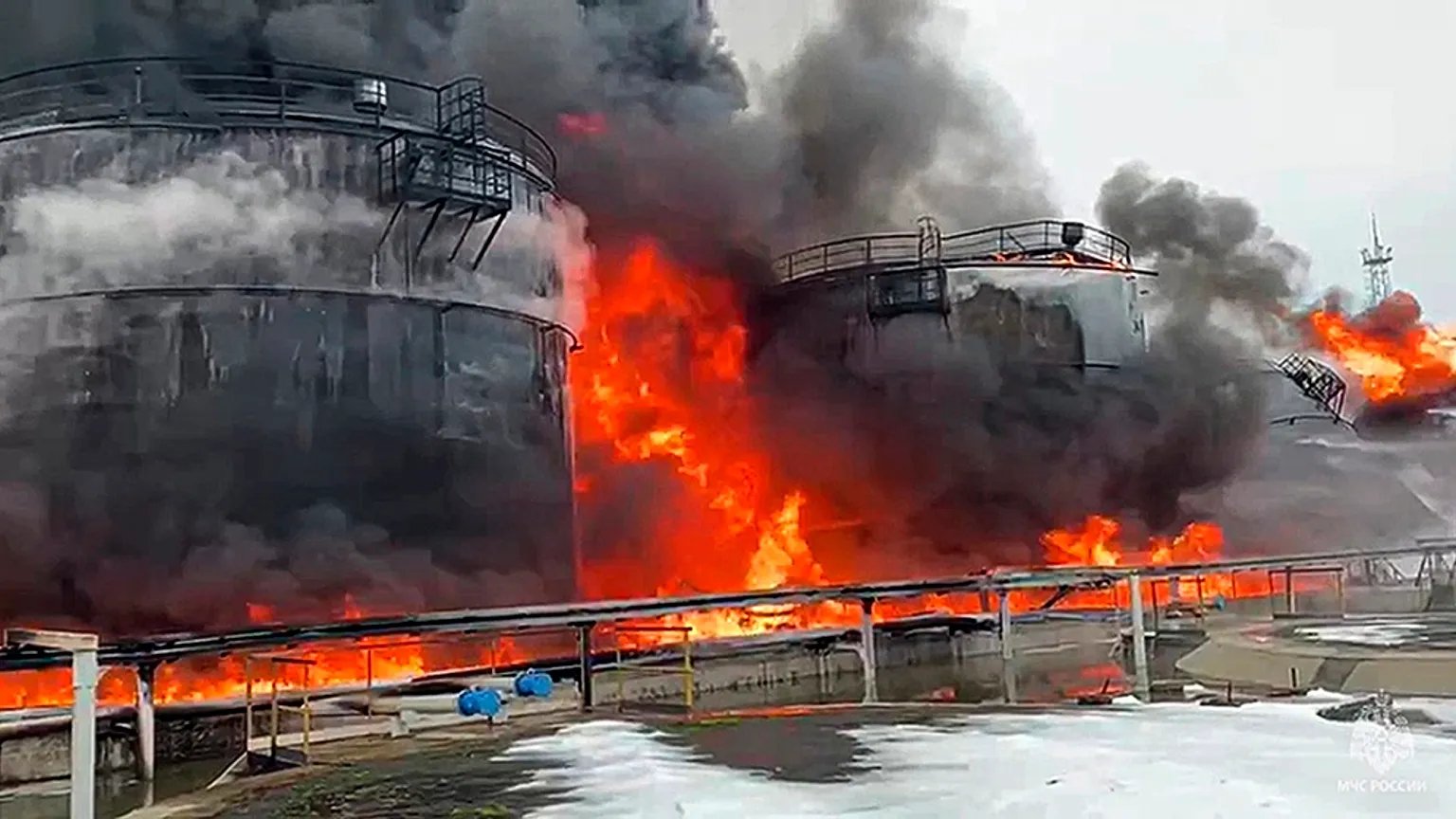 Flames and smoke rising from a Russian oil or petrochemical facility after a reported drone strike