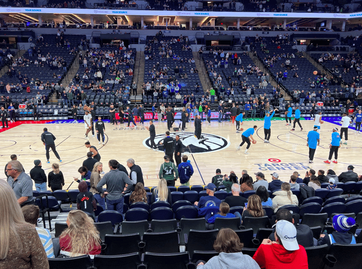 Wide view of the Timberwolves Classic Edition replica parquet court at Target Center for 2025–26.