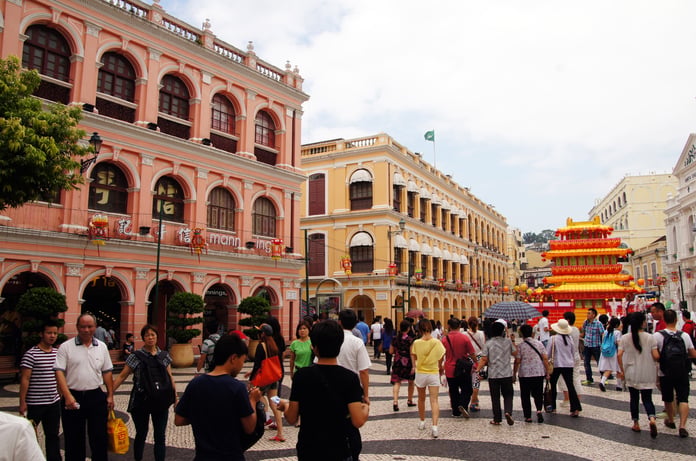 Tourists gather on the steps of the Ruins of St. Paul’s in Macau during a holiday week
