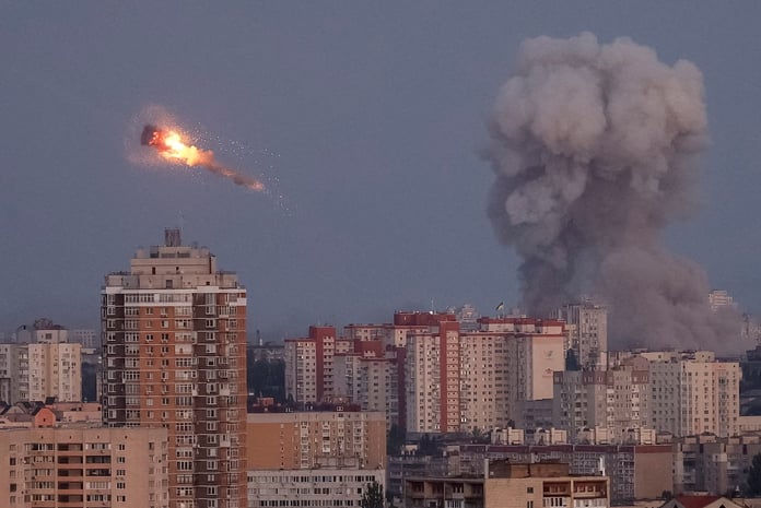 Air defense intercepts over Kyiv during Russia Ukraine war, night sky streaks and explosions