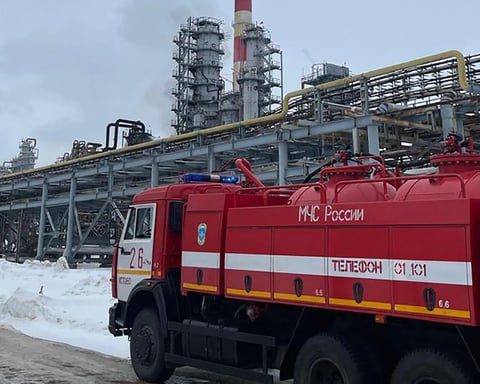 Russian emergency crews repair equipment at the Ryazan oil refinery after a drone incident