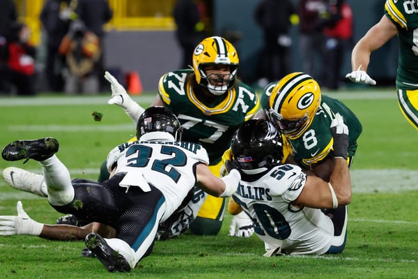 Philadelphia Eagles and Green Bay Packers players on the field at Lambeau Field during Monday Night Football 2025
