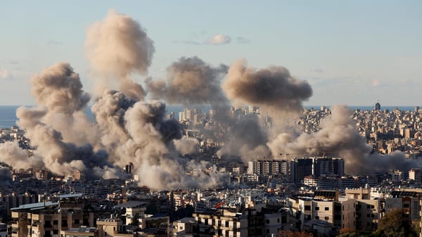 Gaza city skyline with smoke rising amid Israeli airstrikes in 2025