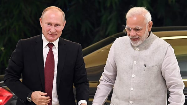 President Putin and PM Modi during India-Russia strategic summit handshake