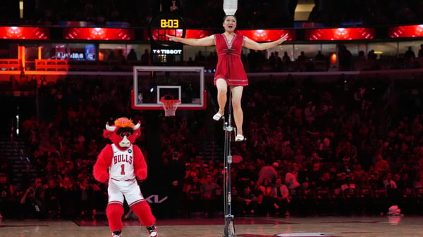 Red Panda performing her iconic balancing act on an 8-foot unicycle at Chicago Bulls NBA game 2025