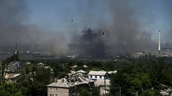 Eastern Ukraine war zone with battle damage and smoke