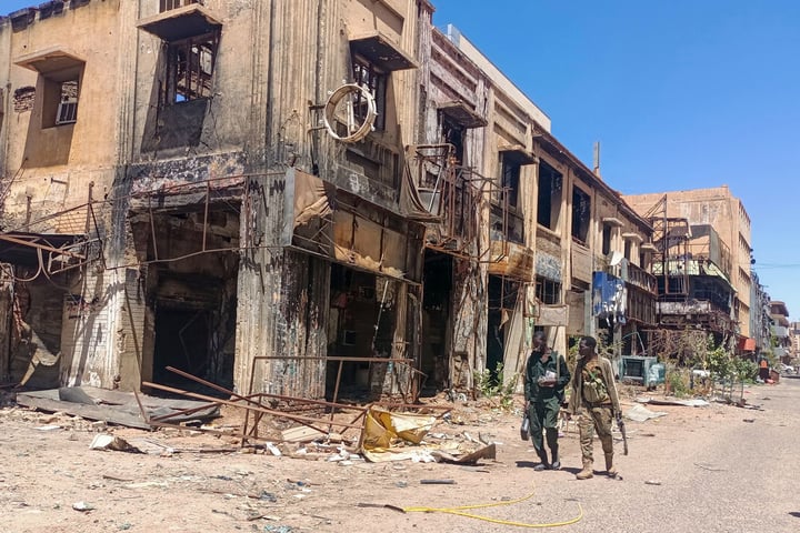 Armed Rapid Support Forces fighters patrolling streets of El-Fasher amid Sudan civil war 2025