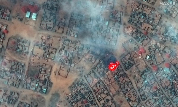 Aerial view of overcrowded displacement camp in Sudan showing thousands of makeshift shelters amid famine conditions during civil war