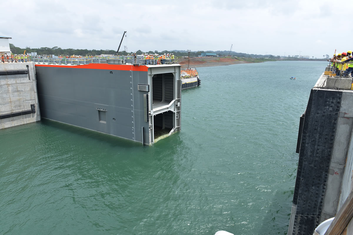 Panama Canal Lock Gates - Technical Diagram of Engineering Mechanism Technical diagram of Panama Canal lock gates system showing miter gates, water culverts, and gravity-powered lock chamber mechanics for raising and lowering ships