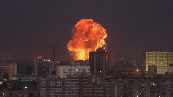 Missile strike aftermath in Kyiv with damaged buildings and smoke rising
