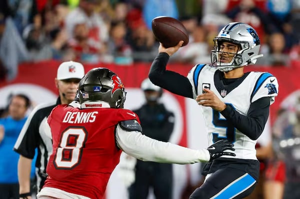 Bryce Young throws pass in rain during Carolina Panthers game against Tampa Bay Buccaneers January 2026