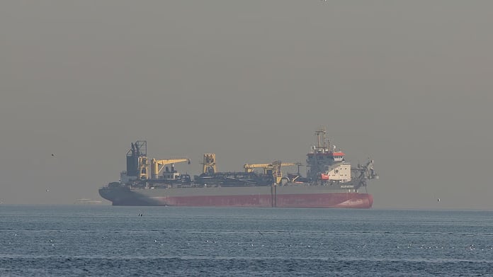 Oil tanker transits the Strait of Hormuz as oil prices surge following US and Israeli strikes on Iran