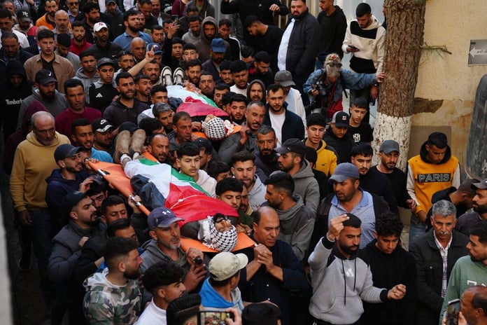Palestinians mourning a 14-year-old boy killed by Israeli soldiers in al-Mughayyir village, West Bank, April 21, 2026.