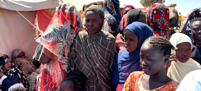 Displaced Sudanese women and children in a refugee camp during the Sudan Civil War