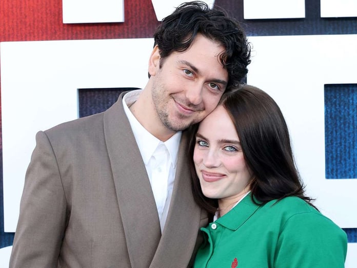 Billie Eilish and Nat Wolff walking together at Hollywood premiere red carpet event 2026