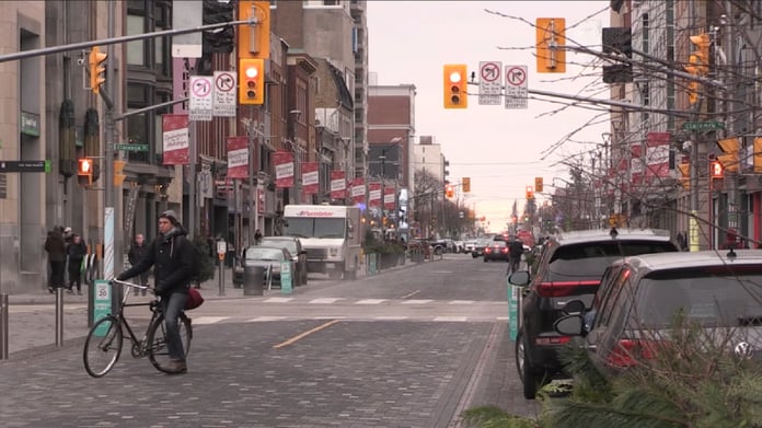 Workers walk through downtown London, Ontario, as unemployment rises across Canada’s industrial economy