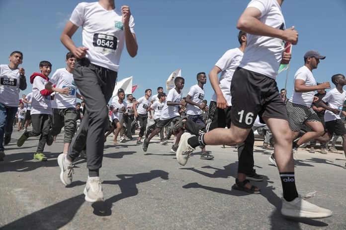 Palestinian and international runners participate in the Palestine Marathon in Bethlehem amid the Gaza war