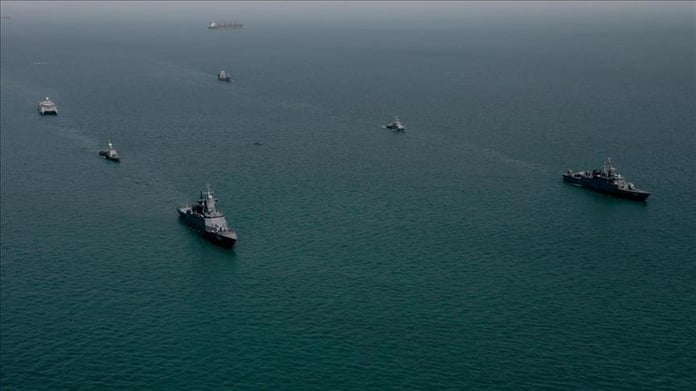 Iranian naval forces oversee oil tanker movement in the Strait of Hormuz amid mine threats