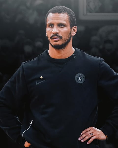 Joe Mazzulla poses after winning the NBA Coach of the Year award for the Boston Celtics in 2026