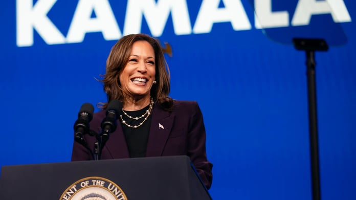 Kamala Harris speaking at podium with symbolic empty donor gala background representing fundraising withdrawal