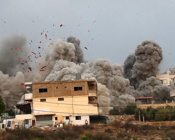 Smoke rises over southern Lebanon following Israeli airstrikes as the death toll surpasses 3,000