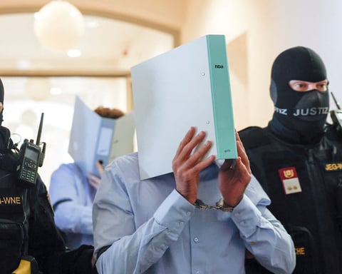 Beran A. covers his face as he enters the Wiener Neustadt court before being sentenced to 15 years over the Taylor Swift Vienna terror plot
