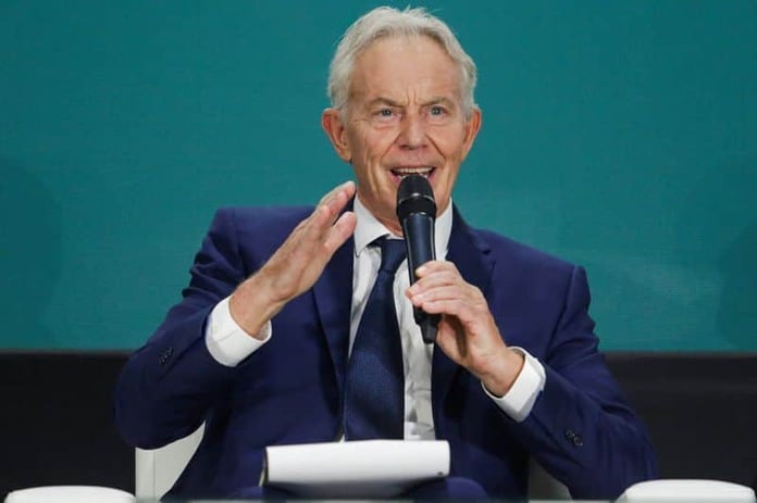 Former British prime minister Tony Blair speaking at a public event, calling for Labour to drop net zero