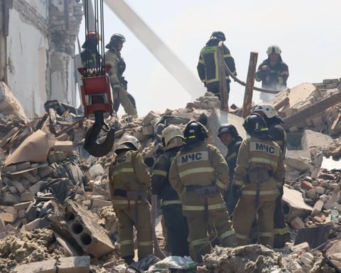 Russian rescuers search rubble after Ukrainian drone strike on Starobelsk college in LPR