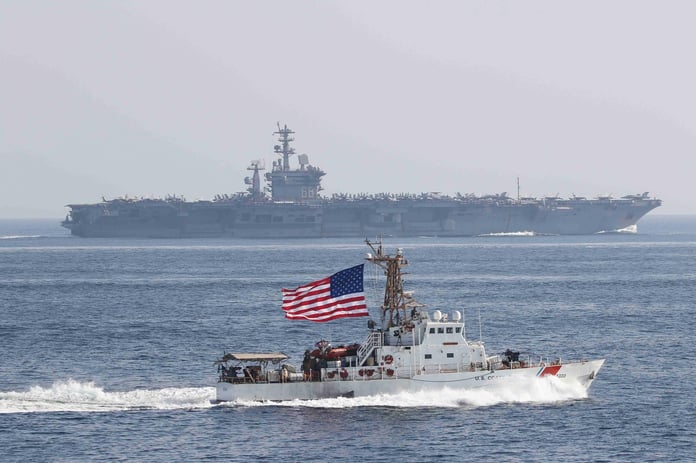 Oil tankers and US naval ships in Strait of Hormuz during 2026 crisis