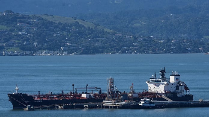 Oil tankers transit through the Strait of Hormuz amid rising US-Iran tensions and global energy market fears