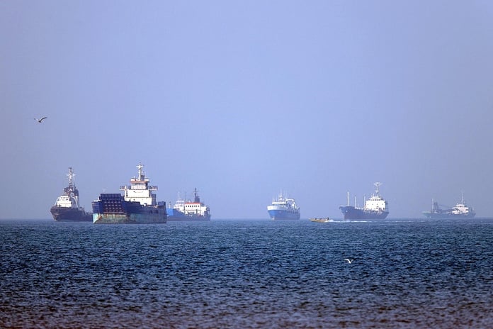 US Navy vessels and oil tankers in the Strait of Hormuz during escalating tensions with Iran in 2026