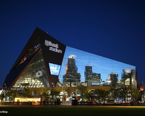 U.S. Bank Stadium with visual overlay representing Minnesota Vikings spending decline and ownership speculation