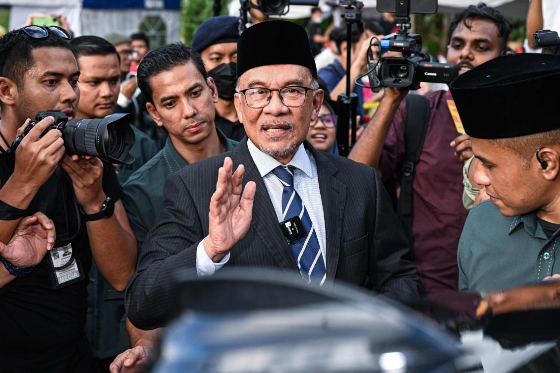 Anwar Ibrahim greets supporters after becoming Malaysia's prime minister in 2022