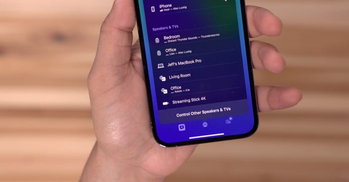 Apple AirPlay icon on iPhone screen with Roku Streaming Stick showing iOS casting interface