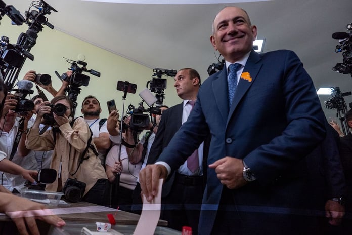 Election officials counting ballots at a polling station in Yerevan after Armenia's June 2026 parliamentary elections