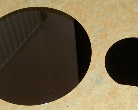 Polished semiconductor wafers, illustrating the China-Infineon gallium nitride chip patent ruling