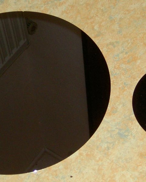 Polished semiconductor wafers, illustrating the China-Infineon gallium nitride chip patent ruling