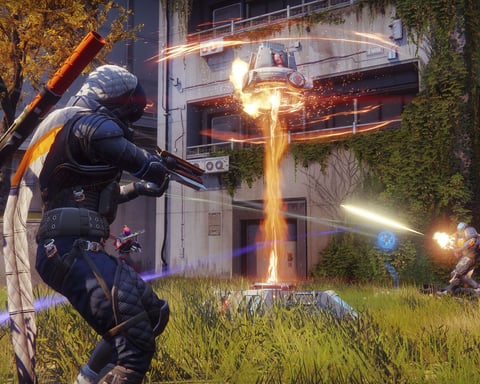 Destiny 2 players battle in a futuristic urban arena during the Monument of Triumph final update launch day