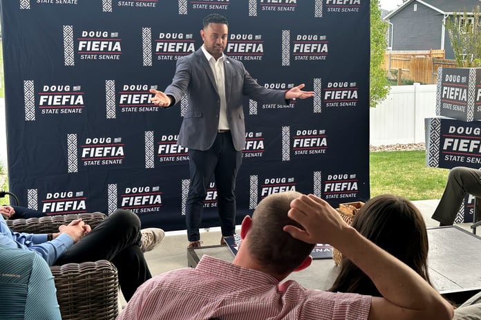 Utah Rep. Doug Fiefia speaks to voters at a backyard gathering in Riverton as he campaigns for Senate District 18