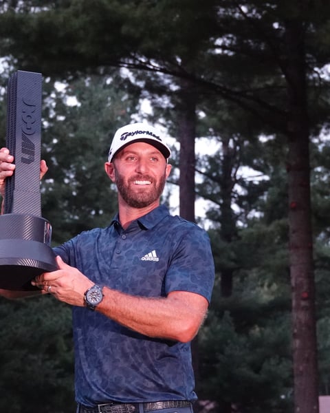 Dustin Johnson celebrating as LIV Golf Boston champion, in the league now facing the end of its Saudi funding