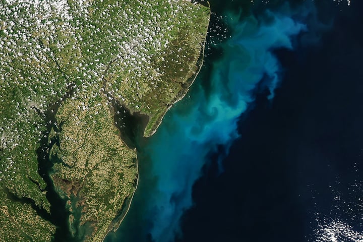NASA Aqua MODIS satellite image of phytoplankton bloom off Mid-Atlantic coast Delaware New Jersey Maryland Virginia May 3 2026