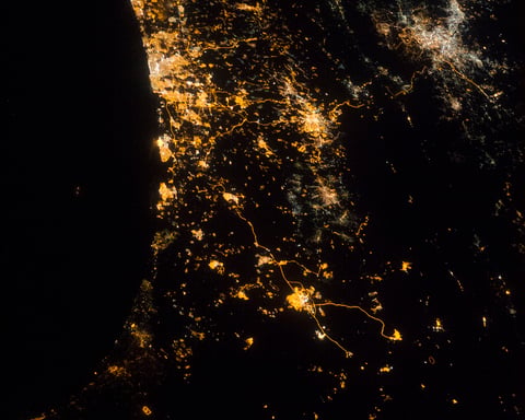 NASA astronaut photograph from ISS of eastern Mediterranean coastline at night showing Tel Aviv Jerusalem Amman July 22 2014