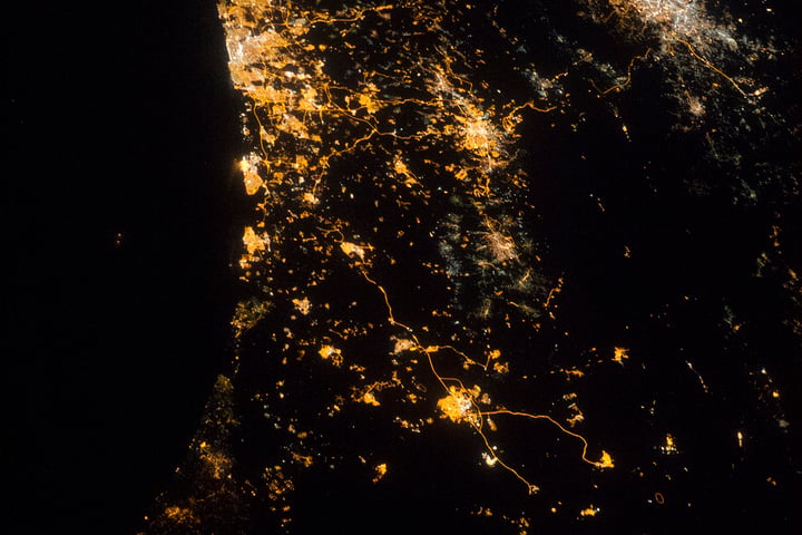 NASA astronaut photograph from ISS of eastern Mediterranean coastline at night showing Tel Aviv Jerusalem Amman July 22 2014