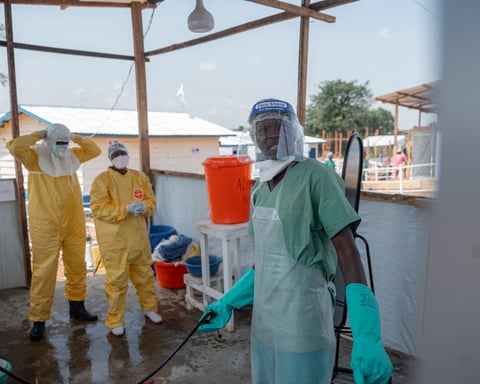 Healthcare workers in protective gear at Ebola treatment centre in Rwampara, Ituri province, DRC