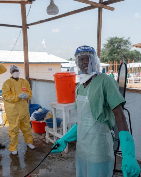 Healthcare workers in protective gear at Ebola treatment centre in Rwampara, Ituri province, DRC