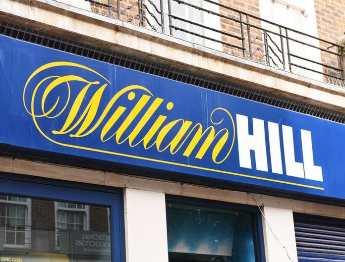 William Hill betting shop exterior Britain Evoke Bally's Intralot takeover 2026